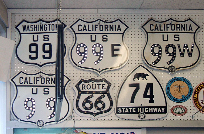 California - State Highway 74, U. S. highway 99E, U.S. Highway 99, and U. S. highway 99W sign.