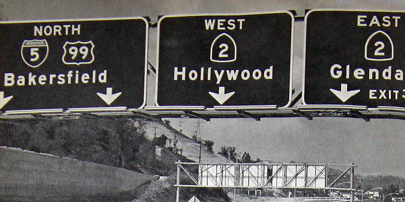 California - State Highway 2, U.S. Highway 99, and Interstate 5 sign.