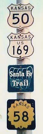 Kansas - State Highway 58, U.S. Highway 169, U.S. Highway 50, and Santa Fe Trail sign.