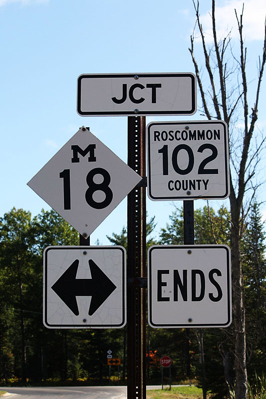 Michigan -  102 and State Highway 18 sign.