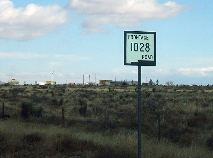 New Mexico state frontage road 1028 sign.