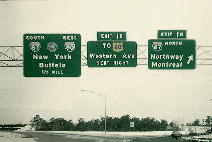 New York - U.S. Highway 20, Interstate 90, New York Thruway, and Interstate 87 sign.