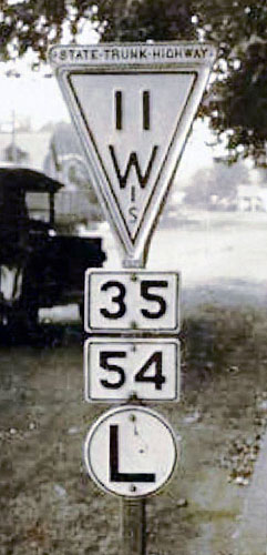 Wisconsin - State Highway 11 and state route left turn marker sign.