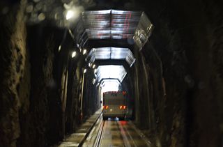 The 11.5 foot wide paved surface through the Anton Anderson Memorial Tunnel accommodates a single lane of traffic.12