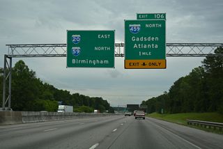 I-20/59 continue between Mc Ashan Mountain and Red Ridge northeast to the trumpet interchange (Exit 106) with Interstate 459.