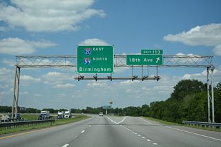 18th Avenue leads west to 24th Street N and east to adjacent Jaybird Road, south of Main Street in Brighton.