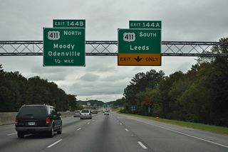 U.S. 411 follows Ashville Road southwest 1.4 miles from Exit 144 A to Whitemire Street, where the route turns south to end at U.S. 78 and 9th Street. North from Exit 144 B, U.S. 411 (Moody Parkway) passes through the communities of Branchville and Odenville on the 25 miles to Ashville.