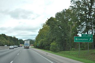 Interstate 20 eastbound at the diamond interchange (Exit 147) with Kellys Creek Road at Brompton. U.S. 78 continues east through Karr Gap to Prescott and Cook Springs on a winding alignment around Sand Ridge.
