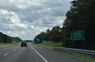 Continuing east from Logan Martin Lake, I-20 next meets Talladega County Route 207 (Honda Drive north / Stemly Road south) at a diamond interchange (Exit 165). CR 207 meanders 8.5 miles south from U.S. 78 (Bankhead Highway) in Lincoln to SR 34 (Stemley Bridge Road) along the periphery of Logan Martin Lake.