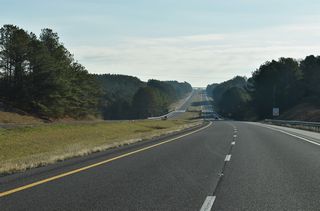 I-22/U.S. 78 lowers ahead of Dry Creek and Marion County Route 301. Rolling hills make up the landscape of the 30 mile stretch between the state line and Winfield.