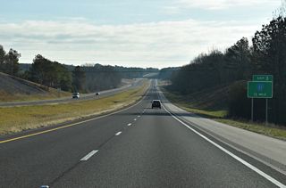 Interstate 22 lowers into a valley fed by Hurricane Creek ahead of the diamond interchange (Exit 3) with County Route 33.