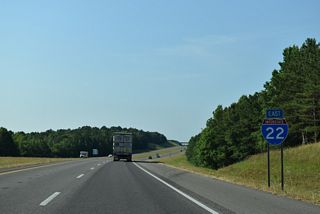 The overpass taking SR 19 across Interstate 22 appears beyond this confirming marker. The state route arcs southwest from Hamilton to Byrd and SR 17 near Detroit.