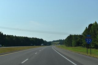 County Route 55 crosses the freeway beyond this confirming shield for Interstate 22 east.