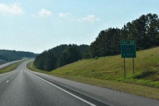 One mile west of the diamond interchange (Exit 22) with Marion County Route 45 near Flurry Branch.