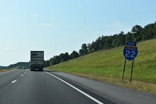 Continuing east, I-22/U.S. 78-SR 4 cross County Route 61 and Dickenson Creek on the ensuing stretch.