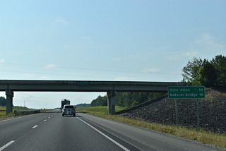 The first distance sign along Interstate 22 east in Alabama references Glen Allen and Natural Bridge, destinations for SR 233 via forthcoming Exit 34.