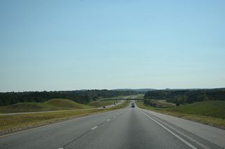 Dogtown Road meanders southeast from Dogtown and crosses over I-22/U.S. 78 south toward Seamore Mountain.
