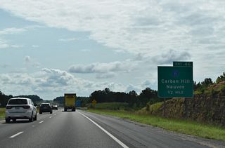 I-22 spans Mill Creek and Clifty Branch ahead of Exit 46. CR 11 links Carbon Hill with the town of Nauvoo and CR 29 (4th Street) near SR 5 and the Winston County line.