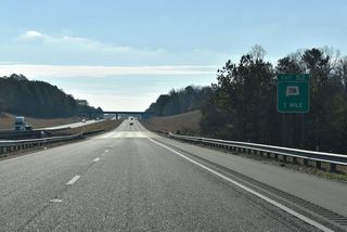 Heading east from Carbon Hill via Pocahontas, SR 118 shifts to the north of Interstate 22 at a parclo interchange (Exit 52) in one mile.