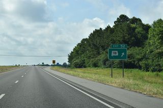Exit 52 departs the eastbound freeway for SR 118. SR 124, 10.90 mile loop southeast to Townley and Exit 61, ties into the state route nearby.