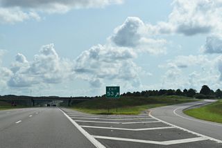 Exit 53 follows with an access road linking I-22 with S Frontage Road and adjacent SR 118 to the east of Wire Road. There are no guide signs for the diamond interchange in either direction of the freeway.