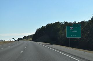 SR 118 branches east from I-22/U.S. 78 beyond the trumpet interchange at Exit 57 in one mile.