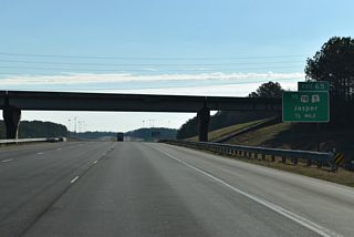 Whitehouse Road heads south from Old Birmingham Highway in Jasper to cross Interstate 22, one half mile west of Exit 65. The local road ties into the south end of Industrial Parkway before continuing east to East Lake Road and Corinth.