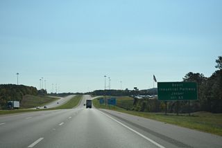 Industrial Parkway comprises a five lane arterial north to the intersection of SR 5 (old U.S. 78) with SR 69 north to Boldo, Red Rock and Cullman. This guide sign was replaced to display Bevill Industrial Park.