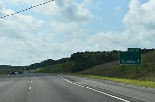 South from Exit 72, County Route 61 traverses hilly terrain 4.65 miles to SR 269, east of High Level.