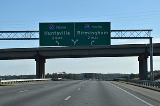 Interstate 22 concludes two miles east of the CR 77 overpass with two lane ramps for I-65 north to Huntsville and south into Birmingham.