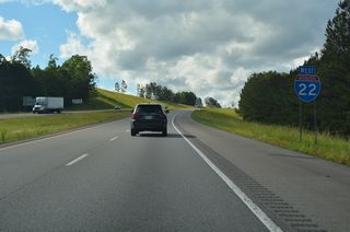 Interstate 22 ascends north from the Buttahatchee River ahead of this confirming marker.
