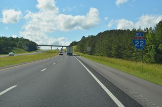 Interstate 22 ascends westward from Luxapallila Creek to the SR 253 overpass in the city of Twin.