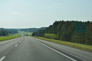 Westbound I-22/U.S. 78 descend to Beaver Creek and a diamond interchange (Exit 22) with Marion County Route 45.