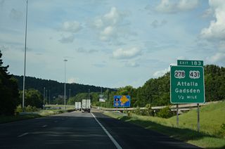 I-59 crosses Big Wills Creek ahead of the split diamond interchange (Exit 183) with Cleveland Avenue and U.S. 278/431 (5th Avenue).