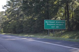SR 77 (Gilbert Ferry Road) meets I-59 south next at folded diamond interchange (Exit 181) north of Northeast Alabama Regional Airport (GAD).