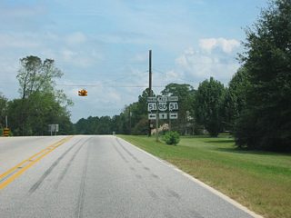 U.S. 80 crosses paths with SR 51 at the rural settlement of Marvyn. The state route travels 15 miles southward to Hurtsboro and north 14 miles to Opelika via the community of Beauregard.
