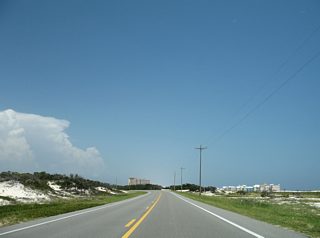 SR 180 (Dixie Graves Parkway) exits the Fort Morgan Unit of Bon Secour National Wildlife Refuge. A mix of protected marshlands, condos, marinas and beach homes dot the landscape along Fort Morgan Peninsula on SR 180.