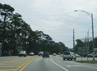 SR 161 constitutes a five lane boulevard south to a condo-heavy stretch of SR 182 between Romar Beach and Perdido Pass. Plastic pylons were added to allow traffic turning south onto Orange Beach Boulevard a free flow movement.