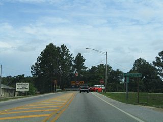 SR 180 takes an abrupt right turn from East Second Street to Canal Drive at the Intracoastal Waterway. An abutment remains at the curve from where a bridge once connected to Baldwin County Road 4 north of the canal. The adjacent SR 59 bridge opened in 1972.