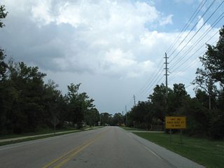 Prior to January 2019, SR 180 continued another 3.8 miles along Canal Road to Caswell on a peninsula surrounded by Arnica Bay, Perdido Bay and Bayou St. John. A series of ends signs marked the end beginning at Pompano Avenue.