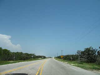 The first SR 180 shield follows the exit of Dixie Graves Parkway from Fort Morgan State Park. The next SR 180 shield appears 20 miles east at SR 59 (Gulf Shores Parkway) in Gulf Shores.The painted median, guard house and associated road widening were removed after 2006.