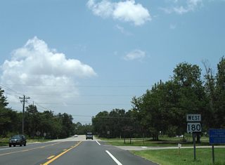 The final westbound SR 180 shield appears 20 miles out from Fort Morgan as the state route leaves SR 59 in Gulf Shores. The combination of Fort Morgan Road and Dixie Graves Parkway is also designated Fort Morgan Parkway.