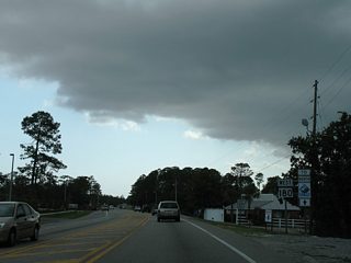 SR 180 (Canal Road) expands into a busy three-lane arterial between SR 161 and the Foley Beach Express.