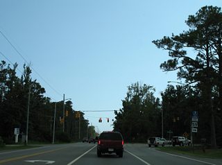 Five blocks south on East 2nd Street is the signalized intersection with East 20th and Dolphin Avenues. Motorists bound for SR 59 (Gulf Shores Parkway) north to Foley should use 20th Avenue to make the connection.