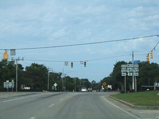 One quarter mile west of SR 135 at SR 59 (Gulf Shores Parkway) on SR 180 (Fort Morgan Road). SR 59 constitutes a five lane arterial between SR 182 (Beach Boulevard) and Foley. The state route provides the only free crossing of the Intracoastal Waterway to the Baldwin County mainland.