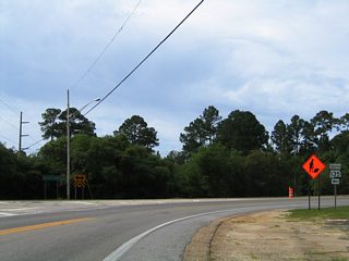 Decommissioned in 2016, SR 135 looped from E Second Street southeast through Gulf State Park to SR 182 (Beach Boulevard). The 2.1 mile long route encircled western reaches of Shelby Lakes between SR 180 and the Gulf State Park Pier.