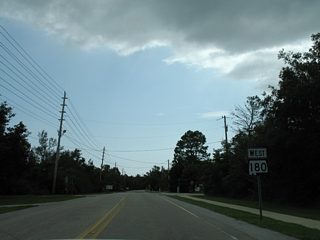 The former westbound beginning of SR 180 on Canal Road at the intersection with Mississippi Avenue east of the Caswell community.
