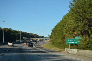 Liberty Parkway arcs southeast from adjacent Overton Road in Birmingham to Sicard Hollow Road (CR 60) in Vestavia Hills.