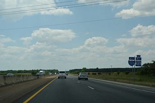 A north side frontage road (Old SR 20) extends west from County Line Road to Exit 3.
