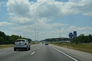 I-565/U.S. 72 Alternate span Indian Creek and continue alongside Madison Boulevard (Old SR 20).